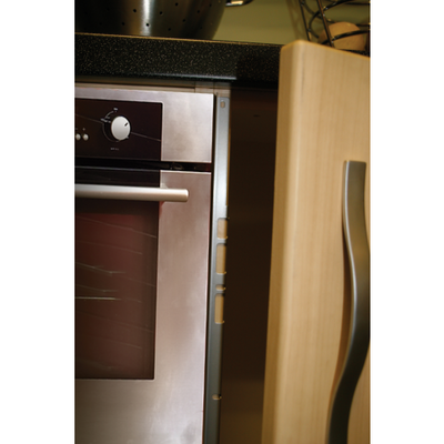 Heat deflector strips fitted to the cabinet edge beside a built-in oven.
