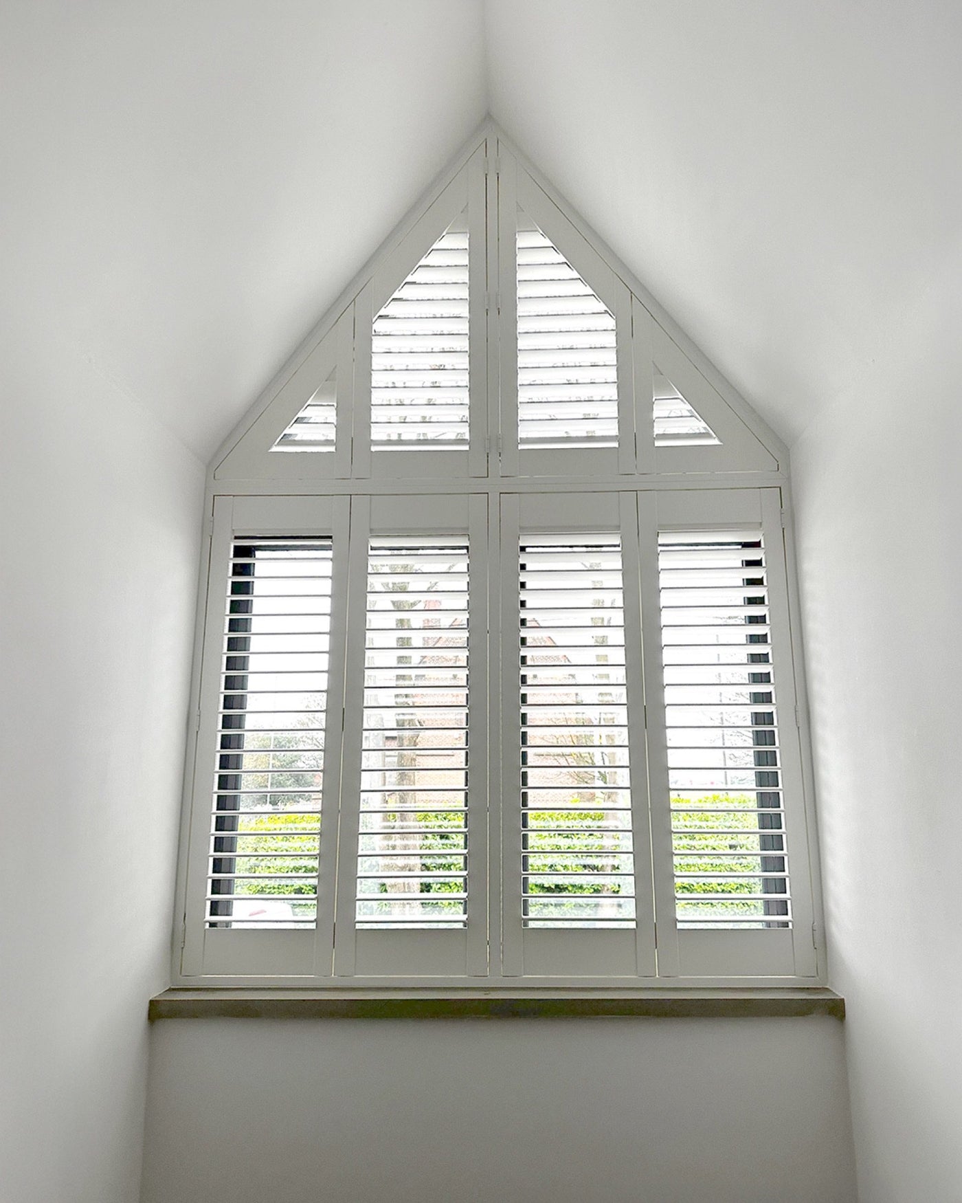 Special shape shutters on an arched window