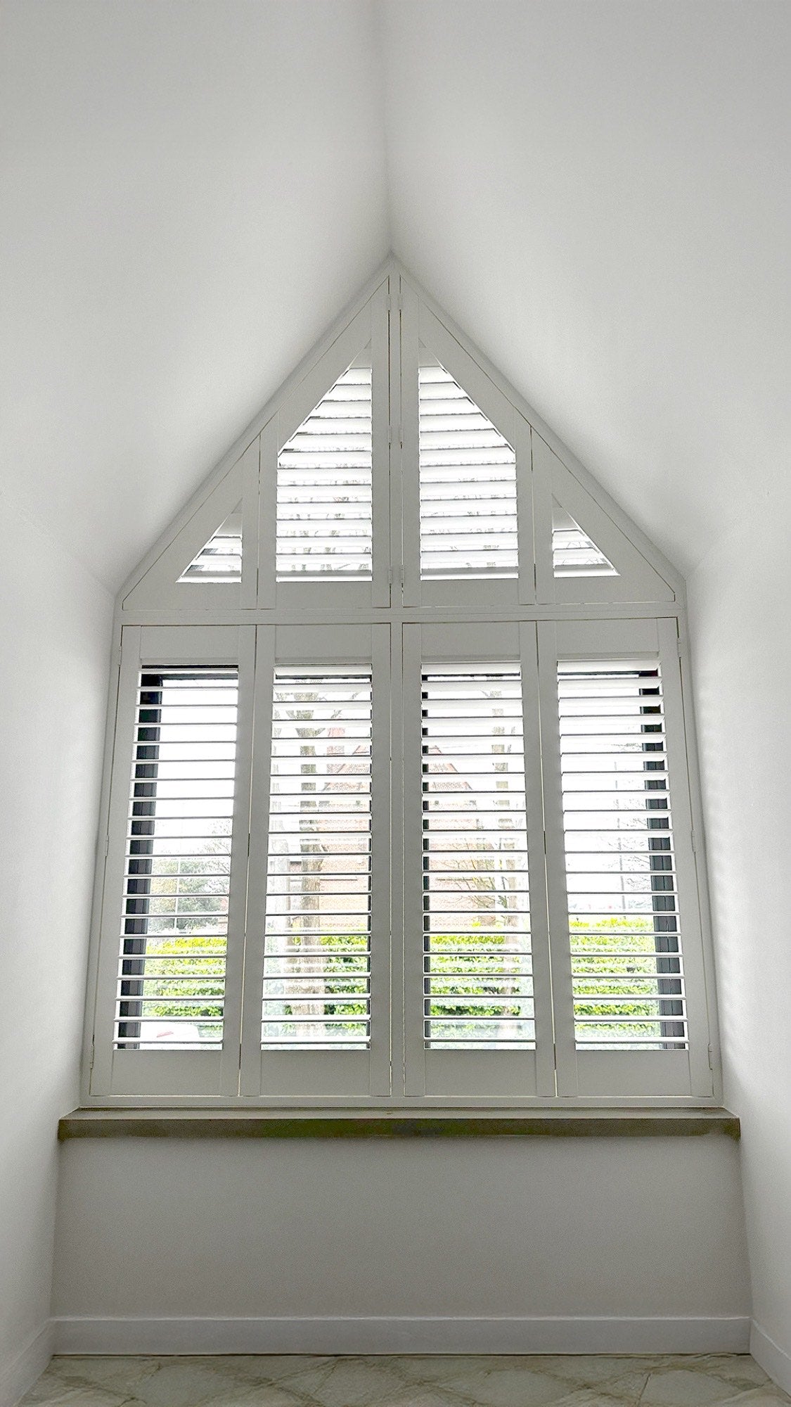 Special shape shutters on an arched window, alternate view