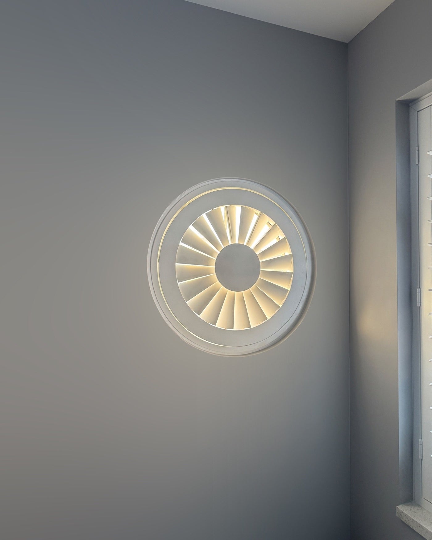 Special shape shutters on a round window