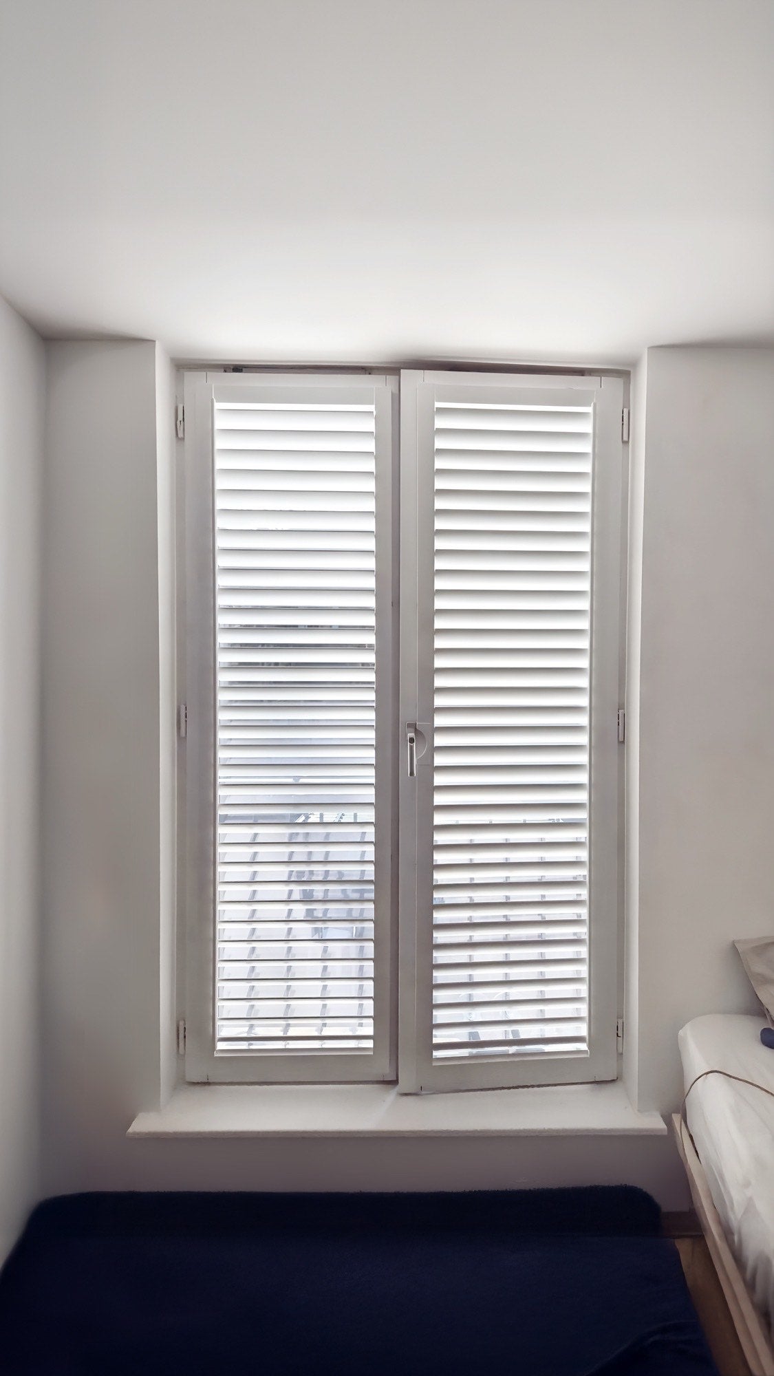 Tracked bi-fold shutters, folded open, alternate view